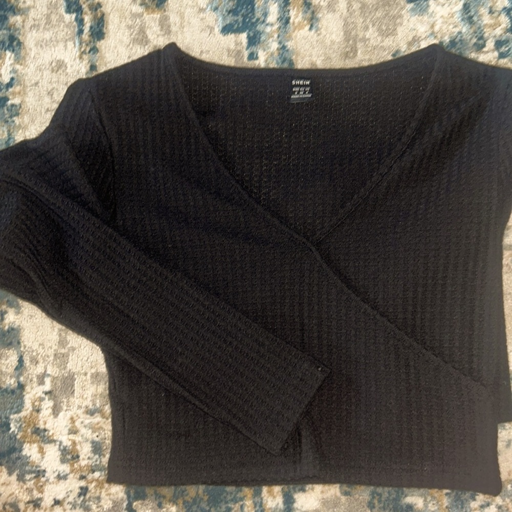 Black cropped sweater with criss cross front